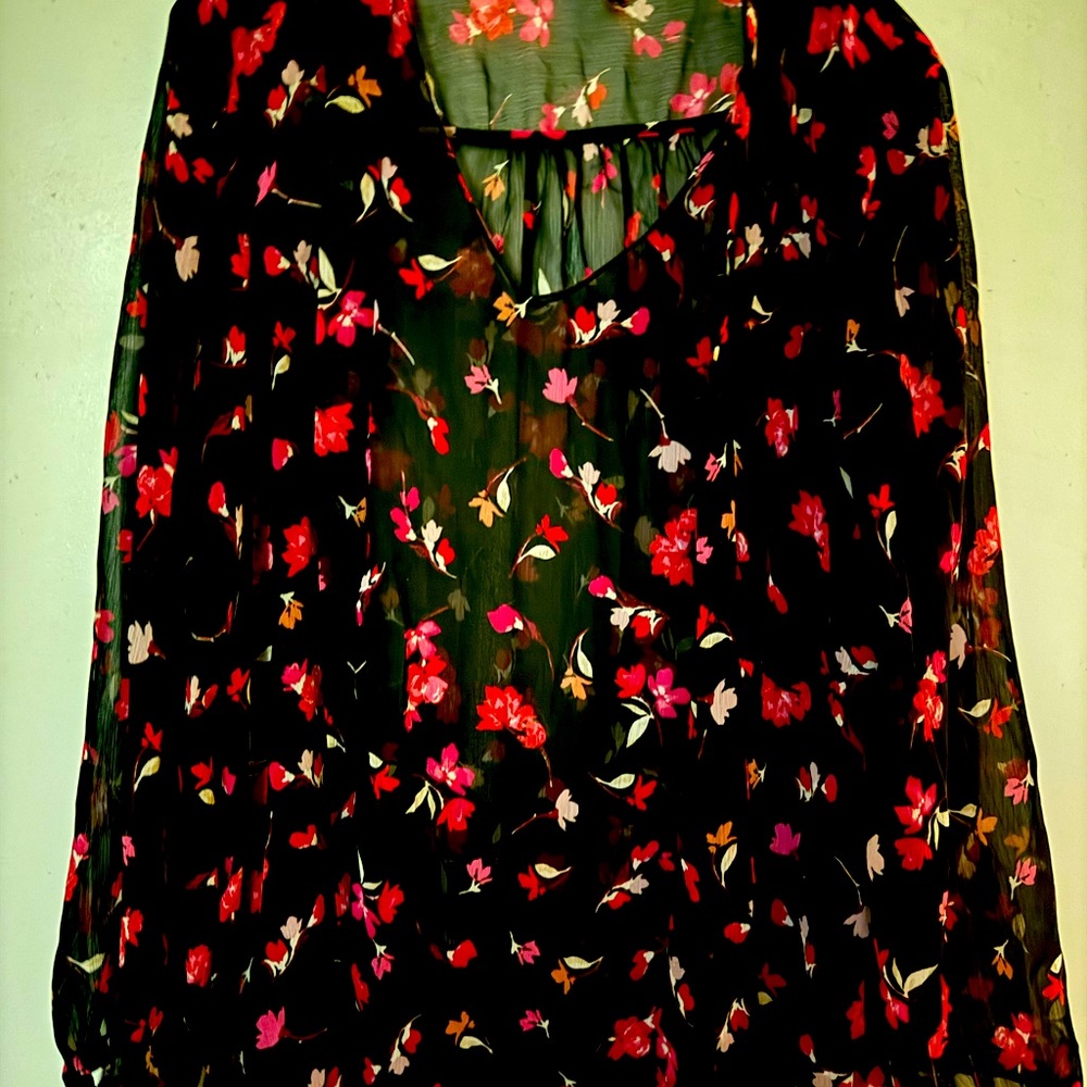 Multi colored soft see through top.Very nice for all occasions.